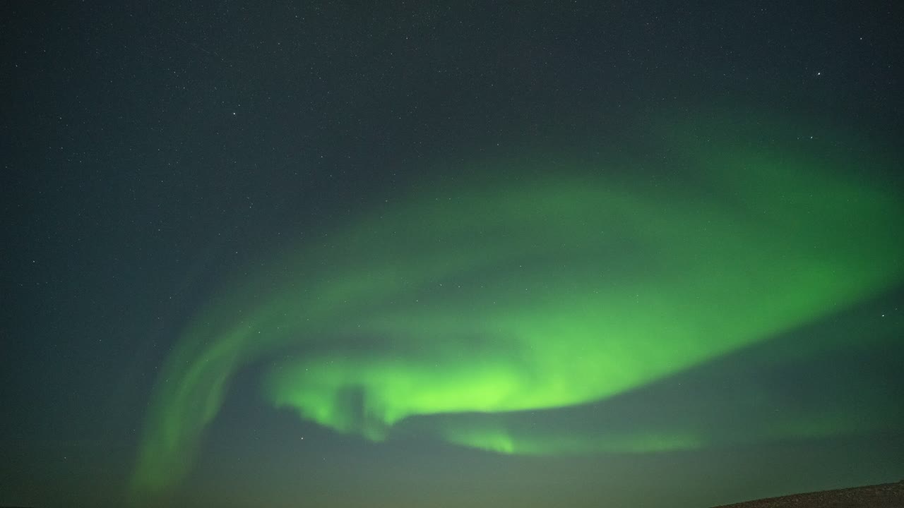 The beautiful dance of the northern lights in the night sky above the ...