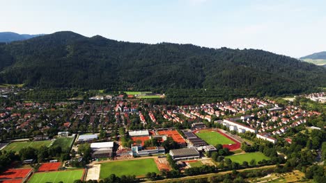 Witness-the-dynamic-energy-of-Freiburg-im-Breisgau-with-exhilarating-drone-footage-showcasing-its-bustling-city-center,-vibrant-markets,-and-lively-atmosphere