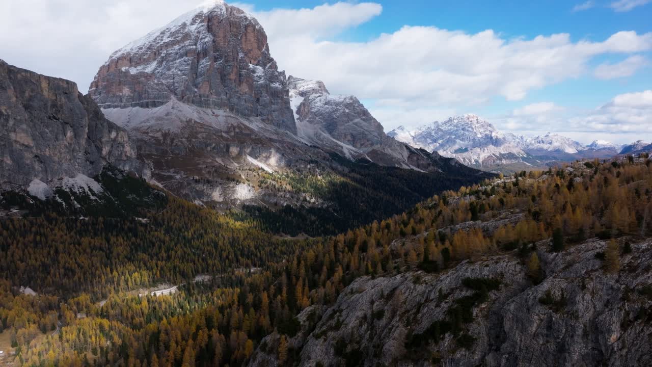 Drone clip of the valleys surrounding the Falzarego pass during peak fall foliage in the Italian Dolomites. Captured in late October