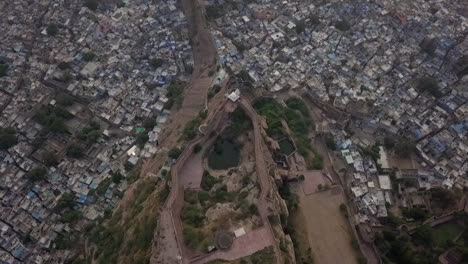 high aerial view of mehrangarh fort lake and jodhpur india far below