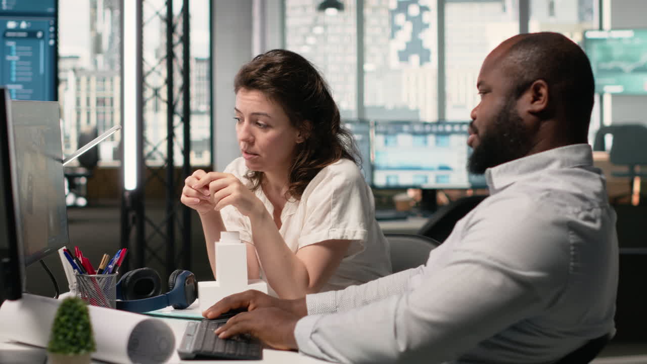 Vertical Video Property development diverse team manages urban projects with digital blueprints