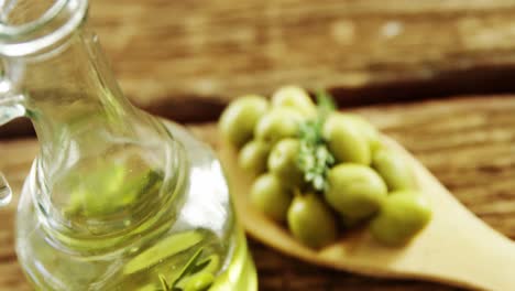 Jar-of-olive-oil-and-green-olives