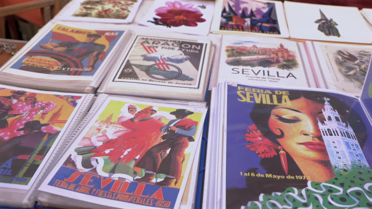 People Browsing Through Seville Poster Illustrations In Local Market