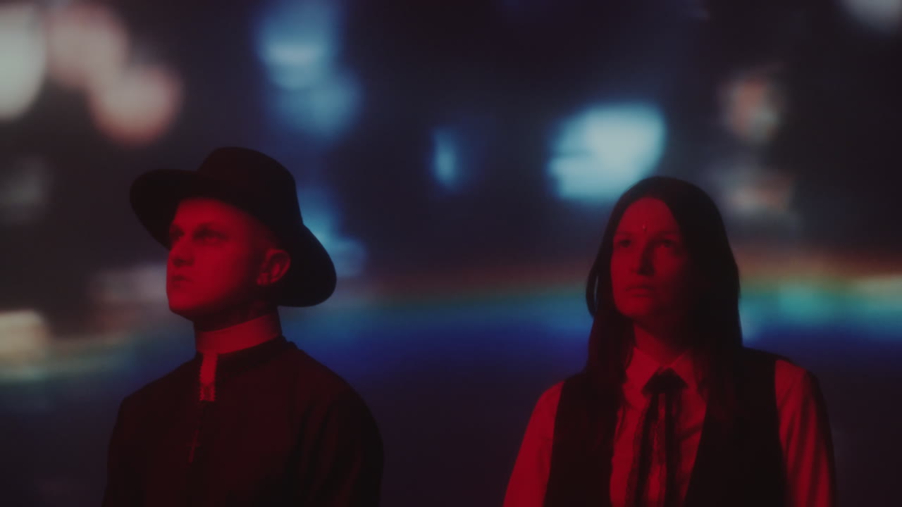 Priest and College Girl in Neon Room