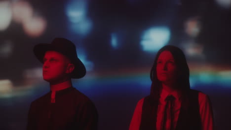 priest and college girl in neon room