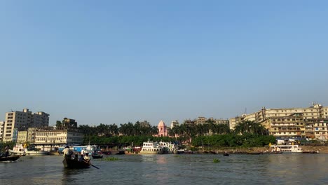 Vertical-view-of-a-commercial-river-port-in-the-mid-afternoon-at-old-Dhaka-city-in-Bangladesh,-India