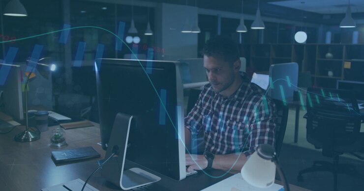 Man typing and analyzing tech data while animated graphs appearing, rubbing eyes, checking phone