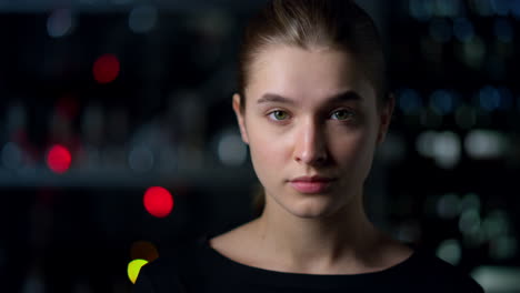 Portrait-of-serious-young-woman-nodding-head-with-positive-gesture-indoors.