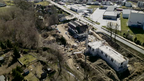 modern construction site in small town, construction crane stands on empty construction site