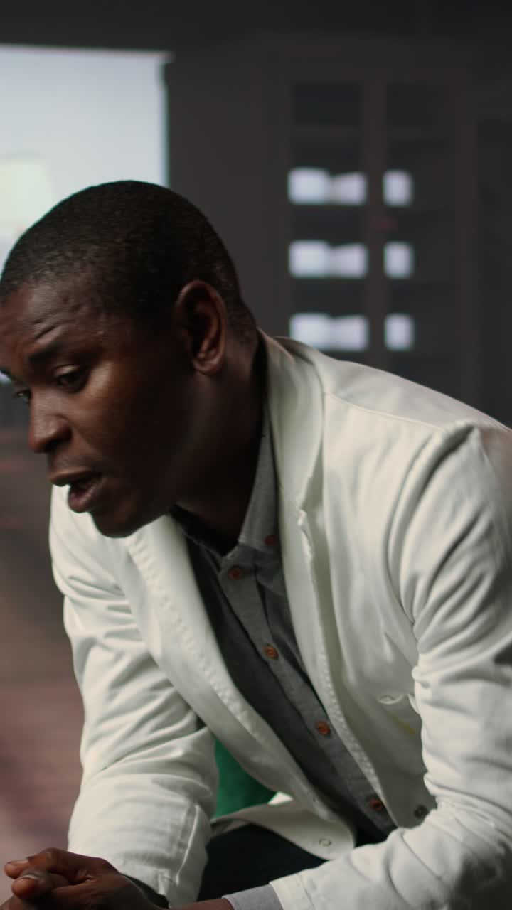 African American Man Showing Distress and Covering Face