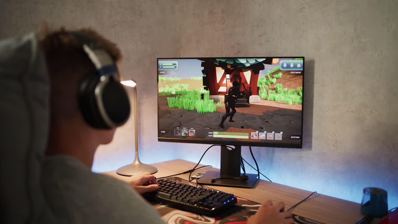 Young person playing video game on a computer