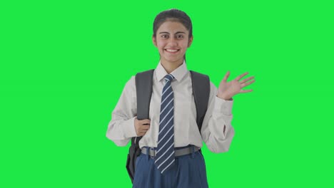 Happy-Indian-school-girl-saying-Hello-to-the-camera-Green-screen