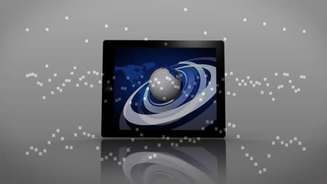 digital globe and swirling graphics displayed on tablet with pixelated animation