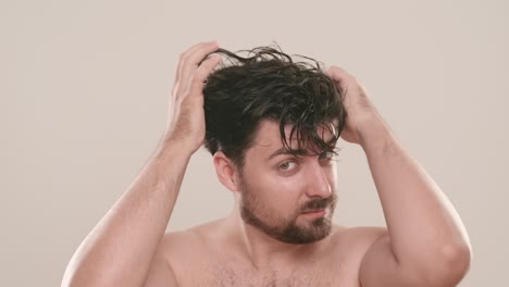 Man styling wet hair