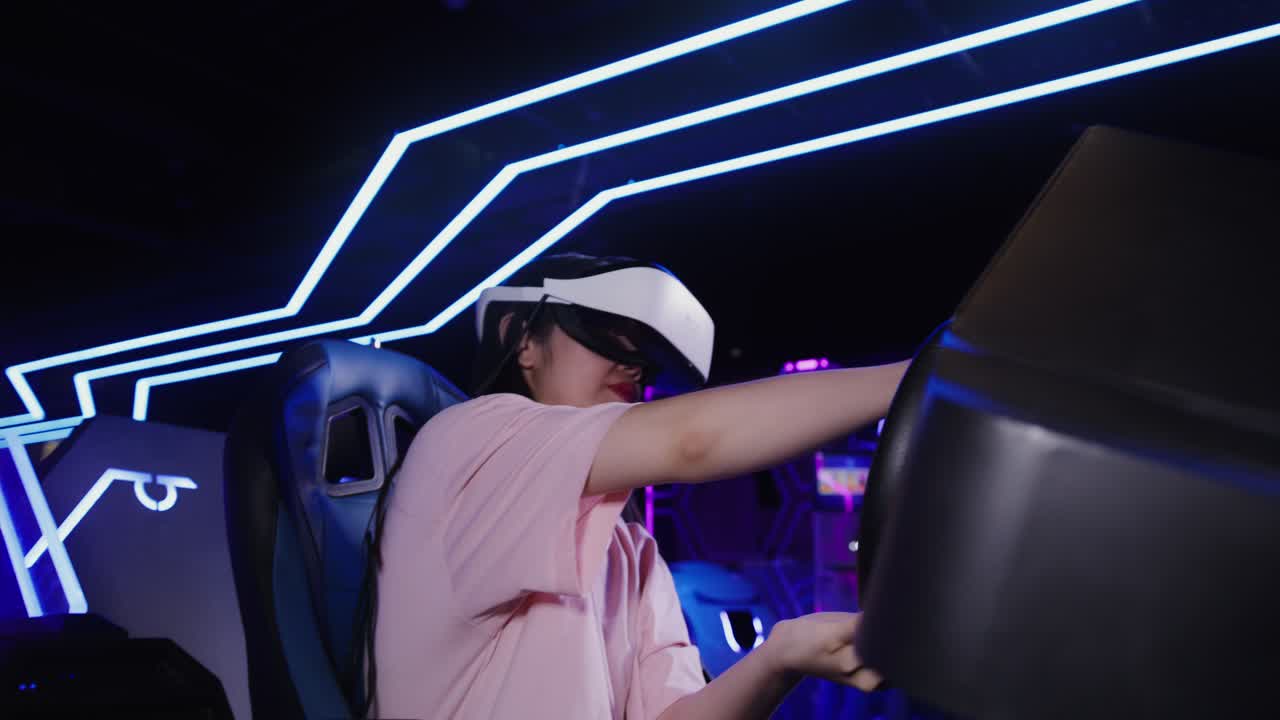 Woman using VR headset in a driving simulator