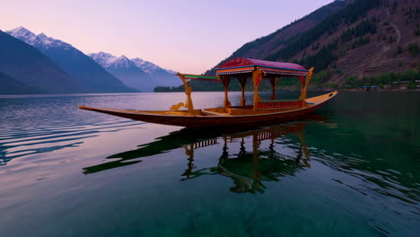 serene mountain lake at sunrise with wooden boat