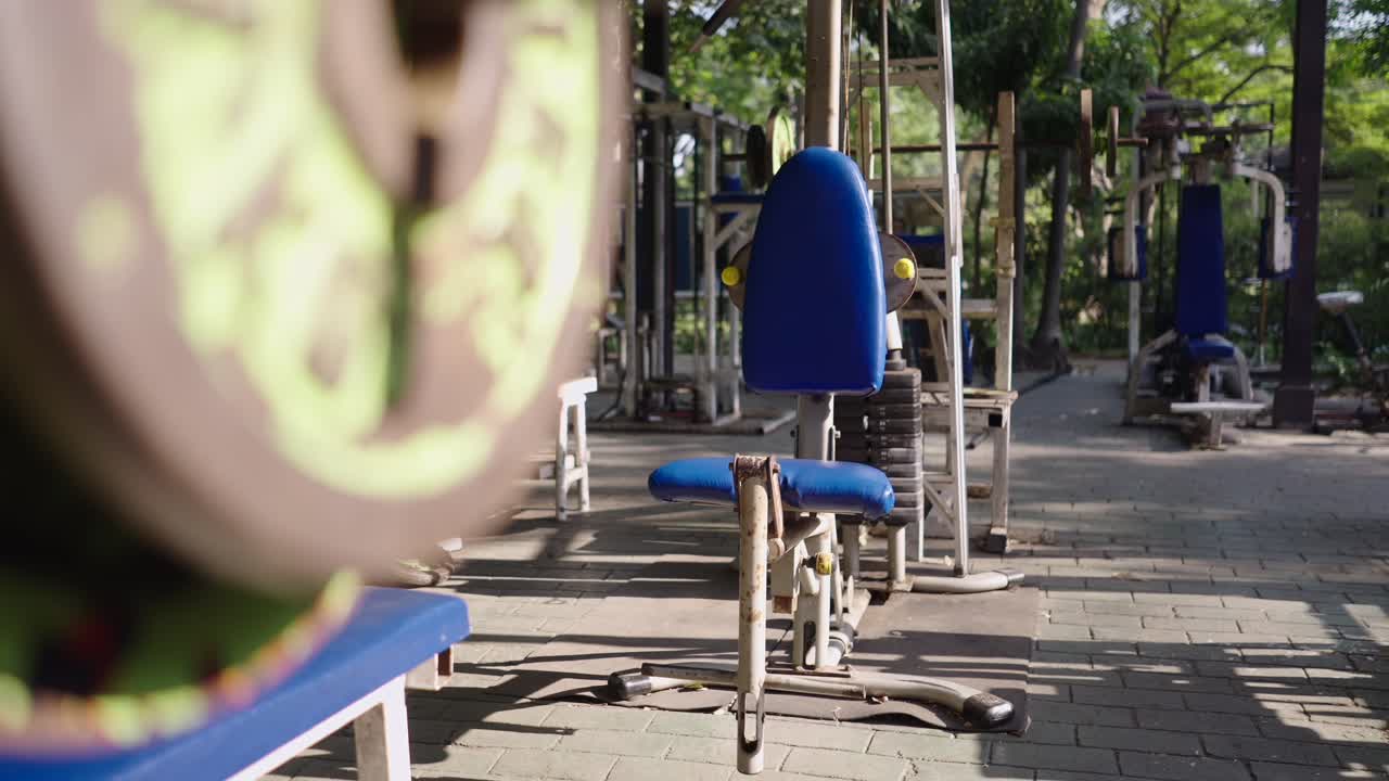 Outdoor gym with various fitness equipment in a park
