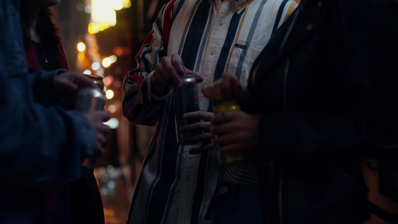 Friends Enjoying Drinks Outdoors at Night