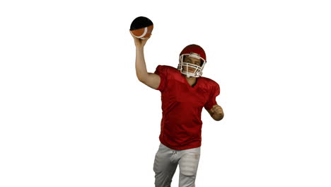 Red-american-football-player-send-the-ball