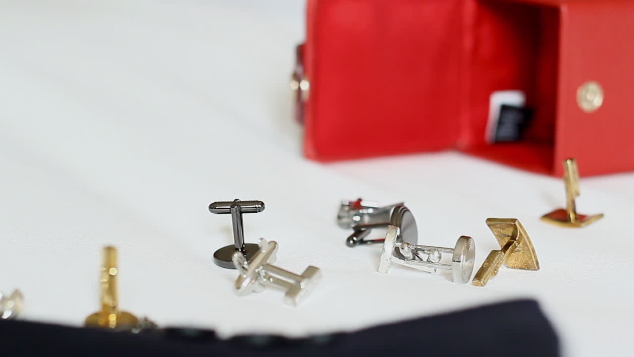 cufflinks spilled out on the bed