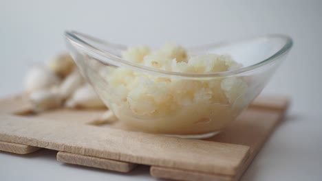 minced garlic in a glass bowl