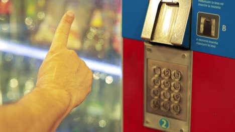 person selecting item from vending machine