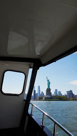 statue of liberty view from a ferry in new york city