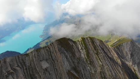 Aerial:-mountain-ridge-among-clouds-in-the-swiss-alps