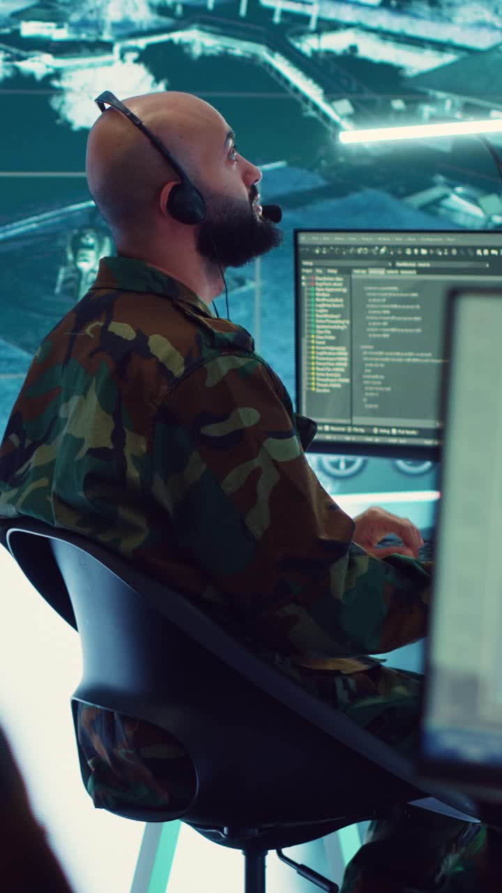 Military Man in Camouflage Uniform Working on Computer in Control Room