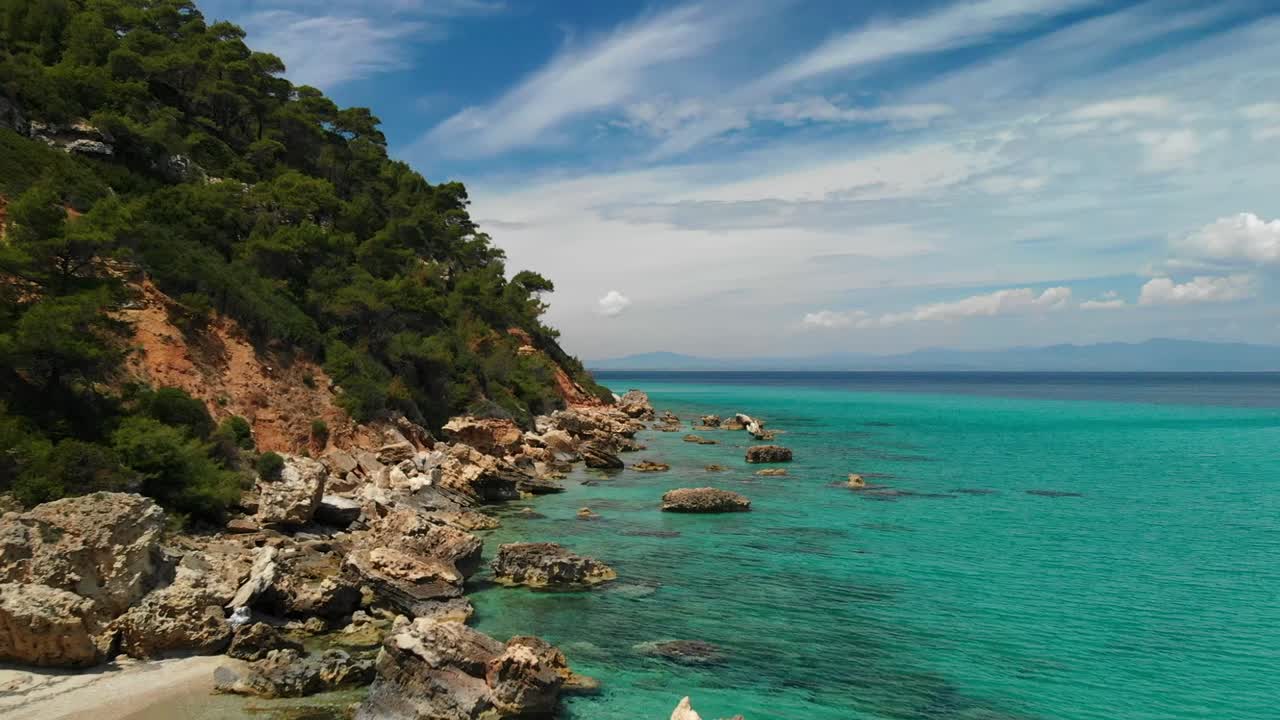 Sunny day on the coast of Halkidiki with blue water and blue sky