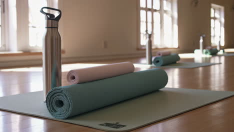 yoga studio with mats and water bottles