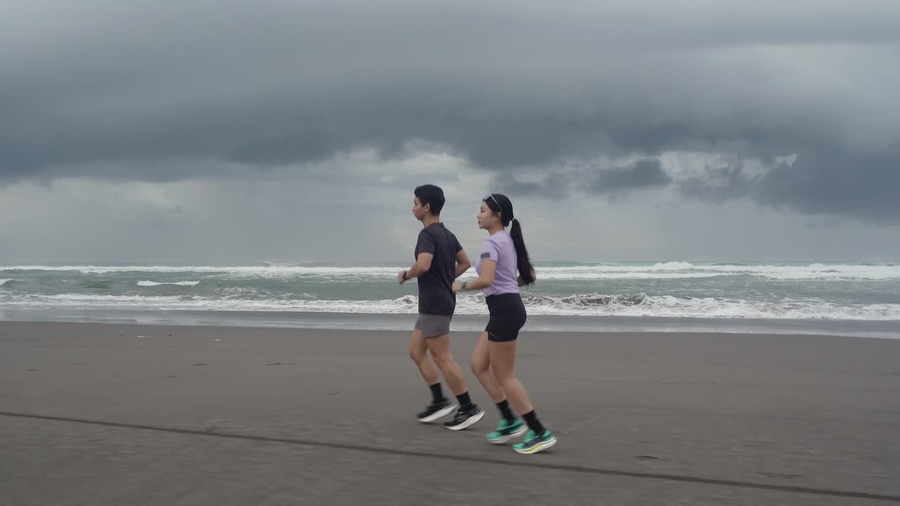 Couple Running on a Beach