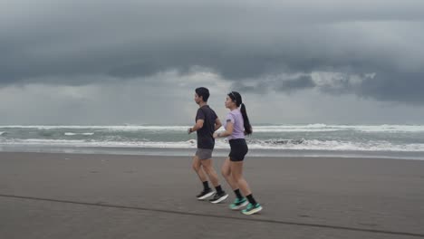 couple running on a beach