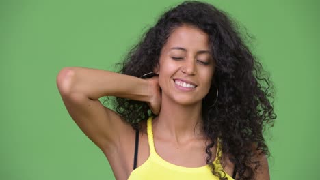 young beautiful hispanic woman having neck pain