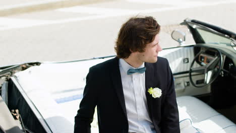 elegant groom in the street