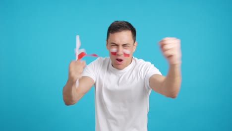 man cheering for poland screaming and waving a national flag