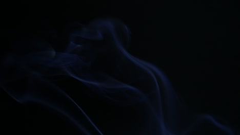 colors smoke in dark background