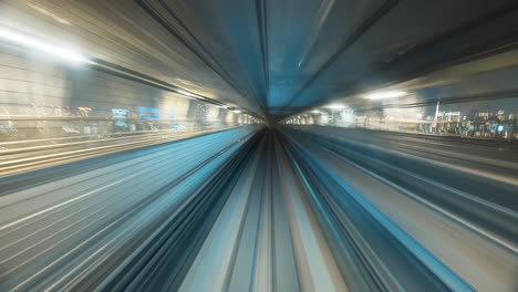 High-rise-Buildings-In-Tokyo-City-Illuminated-At-Night-Seen-From-Yurikamome-Line-In-Japan