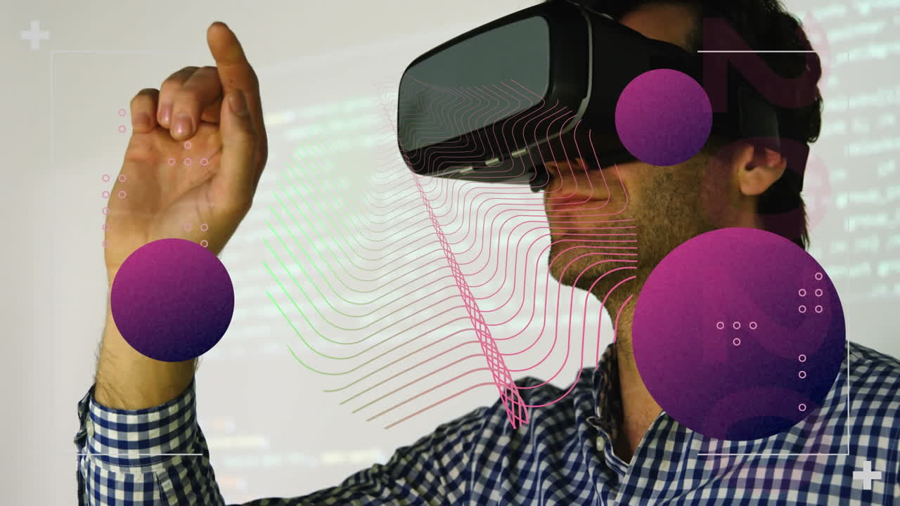 Animation of abstract shapes against caucasian man wearing vr headset at office