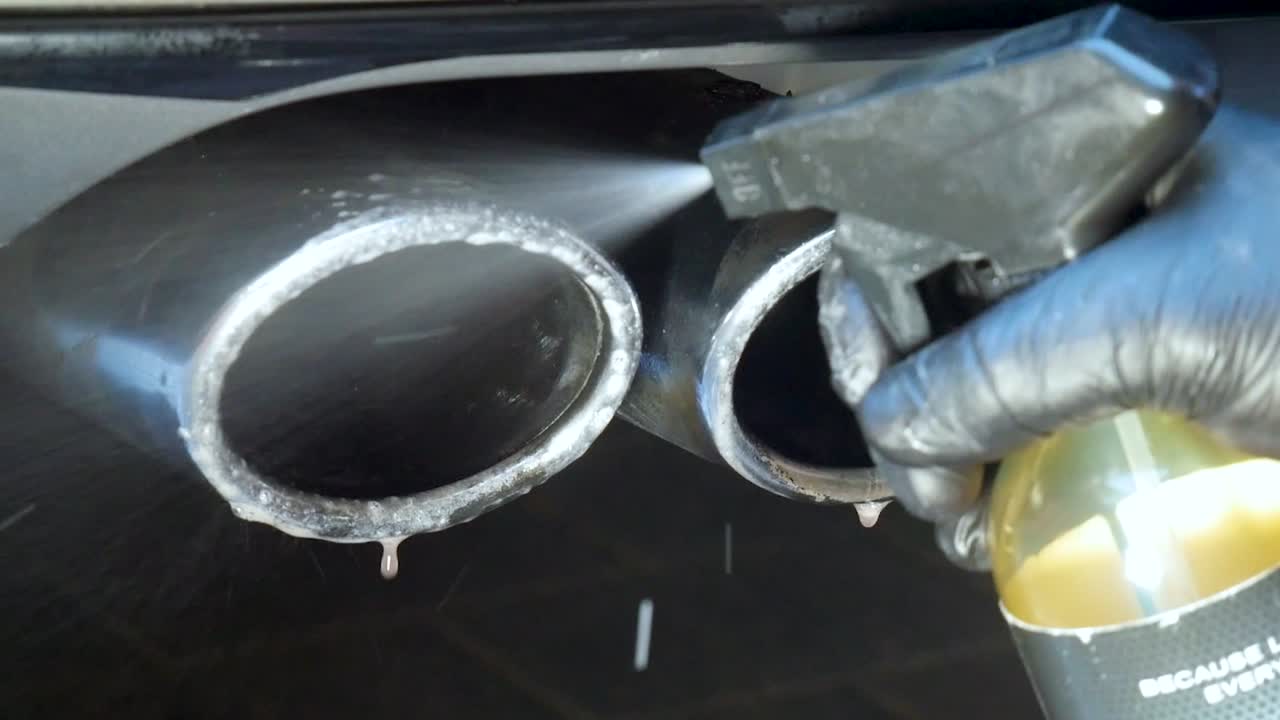 Spraying Exhausts With Chemical Cleaner