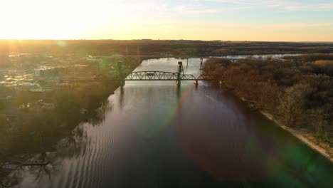 Aerial-ascent-over-Mississippi-River,-with-both-Hastings-bridges-in-view