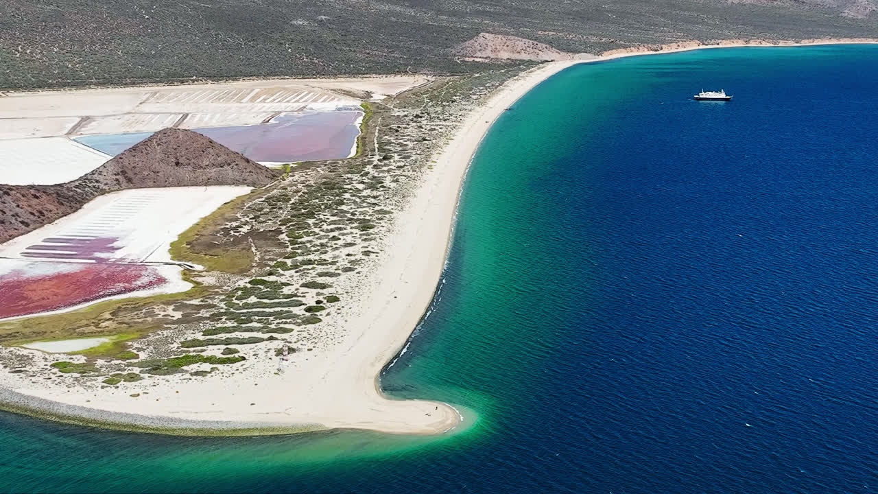 Cinematic Blue Ocean beach View from High Angle. Cruise ship in the distance. Baja.