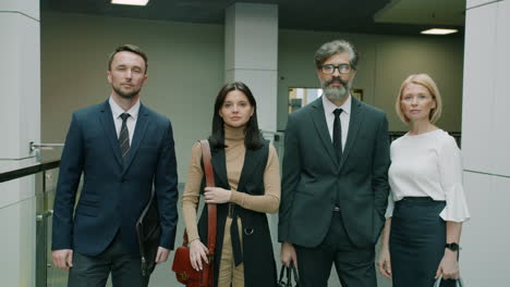 Business Team in Office Corridor
