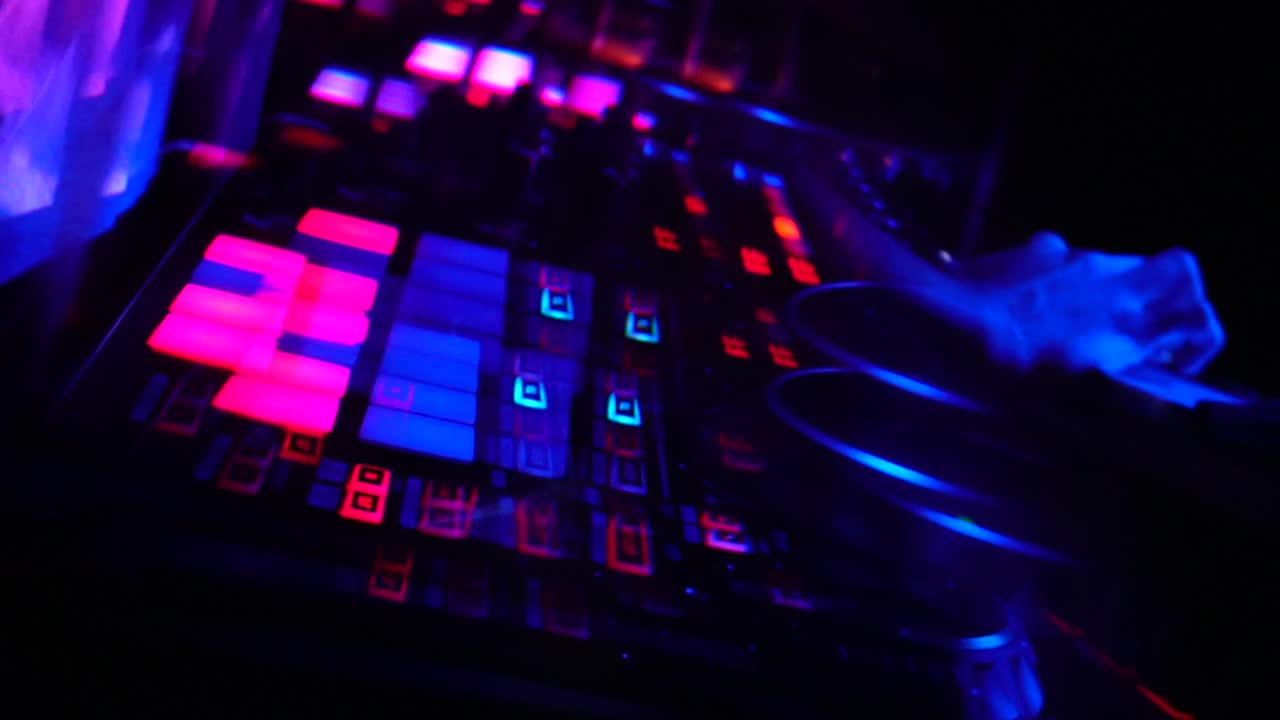 Rolling kaleidoscope bokeh shot of a Dj booth spinning in a night club, HD 1080p, 59.94p B Roll