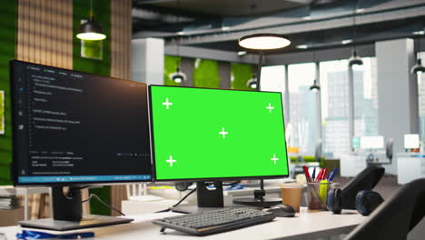 green screen pc display on startup office desk showing programming languages