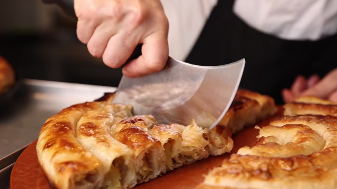 Chef Slicing Delicious Golden Brown Burek Pastry