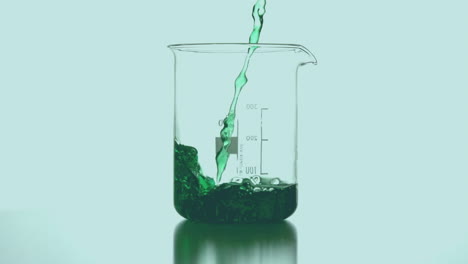 animation of green shapes over beaker with liquid