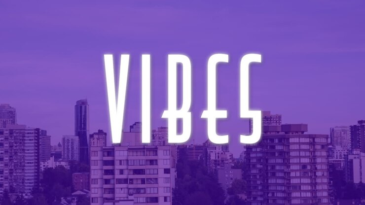 Animazione del testo 'vibes' in bianco su cielo viola e skyline.