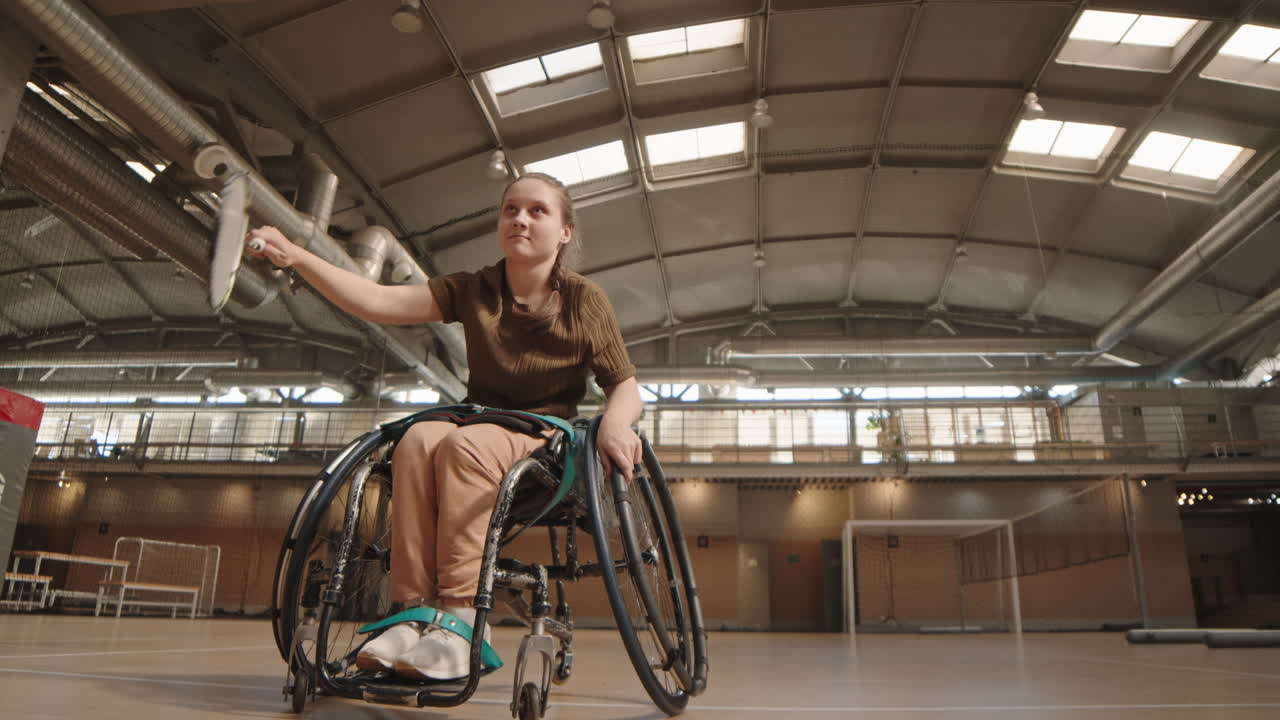 Girl in Wheelchair in Indoor Court