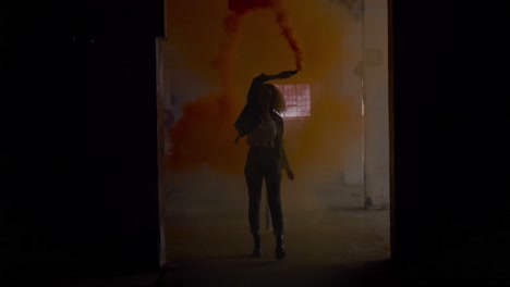 fashionable young woman in an abandoned warehouse